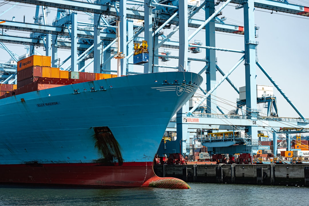 Cargo ship docked at a busy port, representing Nigeria's Free Trade Zones