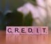 Wooden block spelling credit, representing Nigerian tax credits and incentives